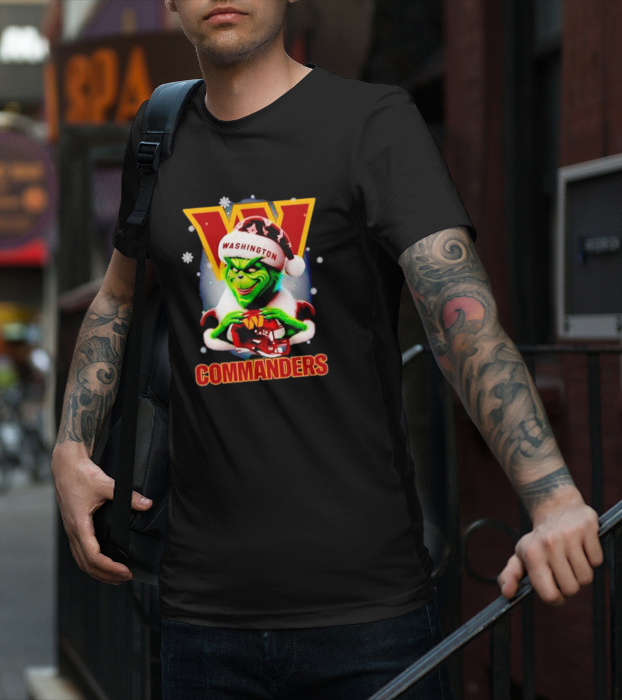 The Grinch Wearing Santa Hat Holding Gift For Washington Commanders Christmas T-Shirt