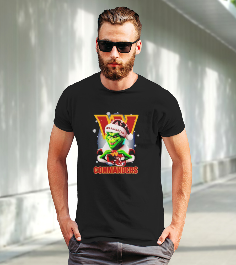 The Grinch Wearing Santa Hat Holding Gift For Washington Commanders Christmas T-Shirt