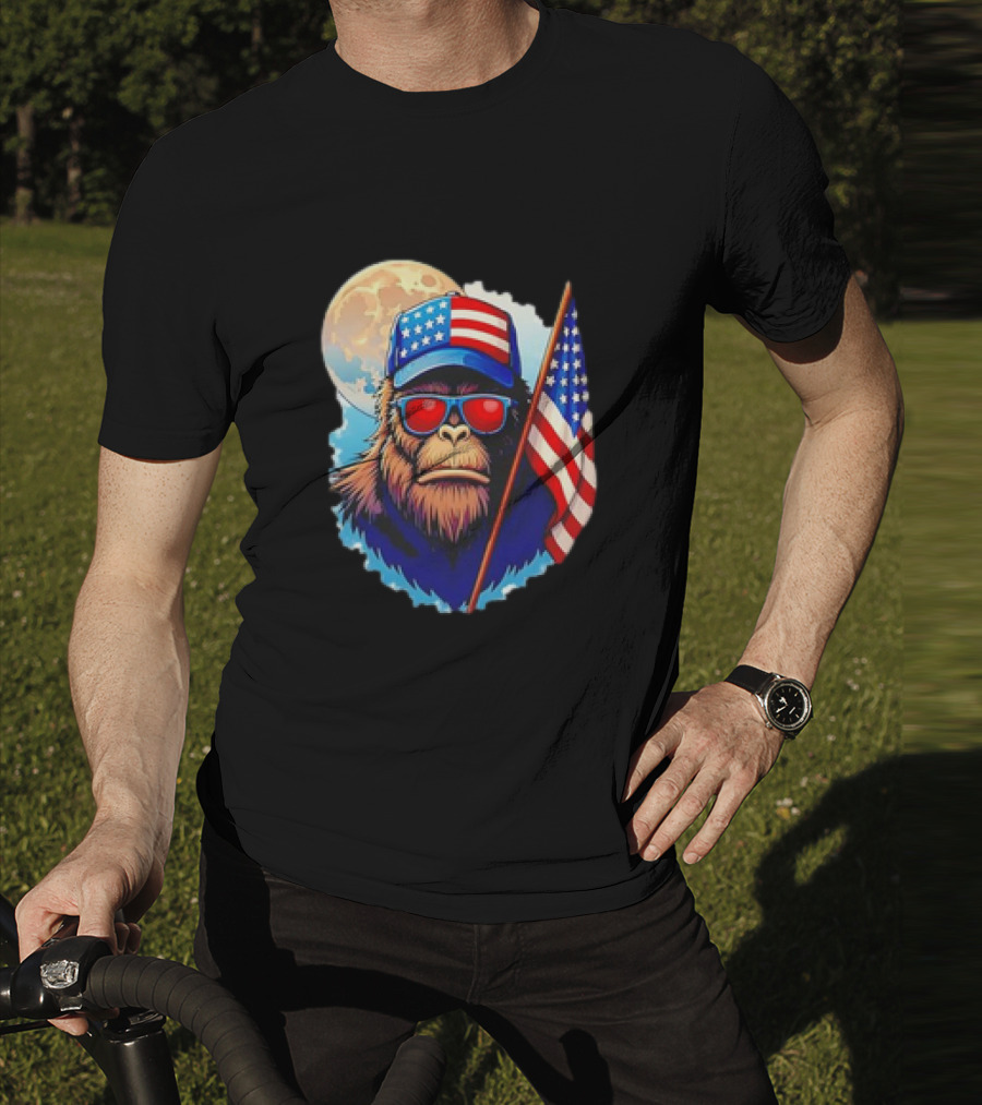 Bigfoot USA Flag Hat Sunglasses Patriotic Moon Background T-Shirt