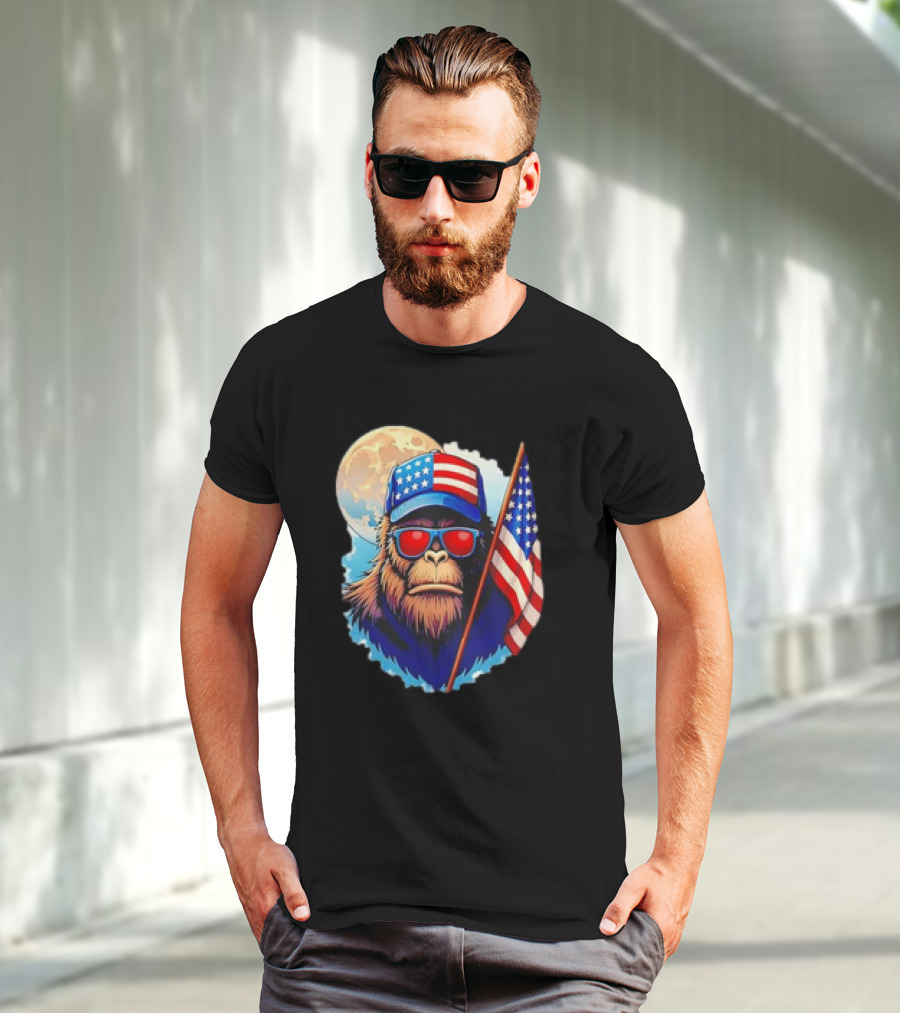 Bigfoot USA Flag Hat Sunglasses Patriotic Moon Background T-Shirt