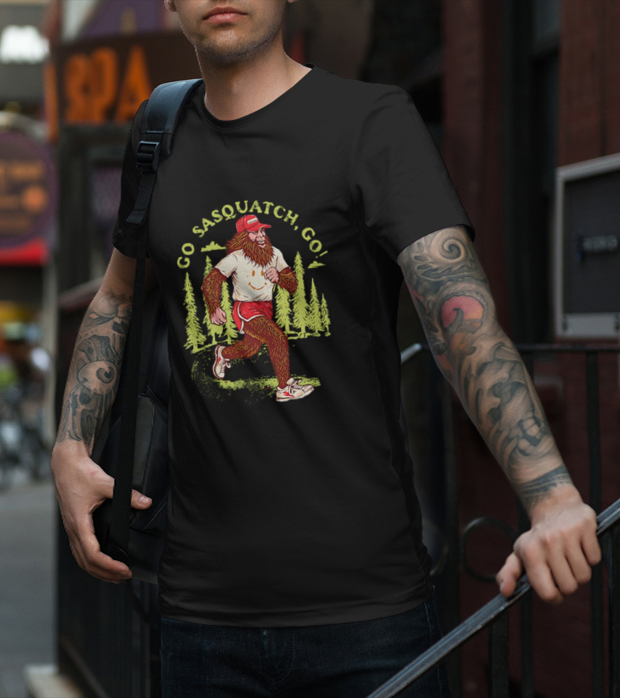 Go Sasquatch Go Bigfoot Jogging In Forest With Red Cap And Sneakers T-Shirt