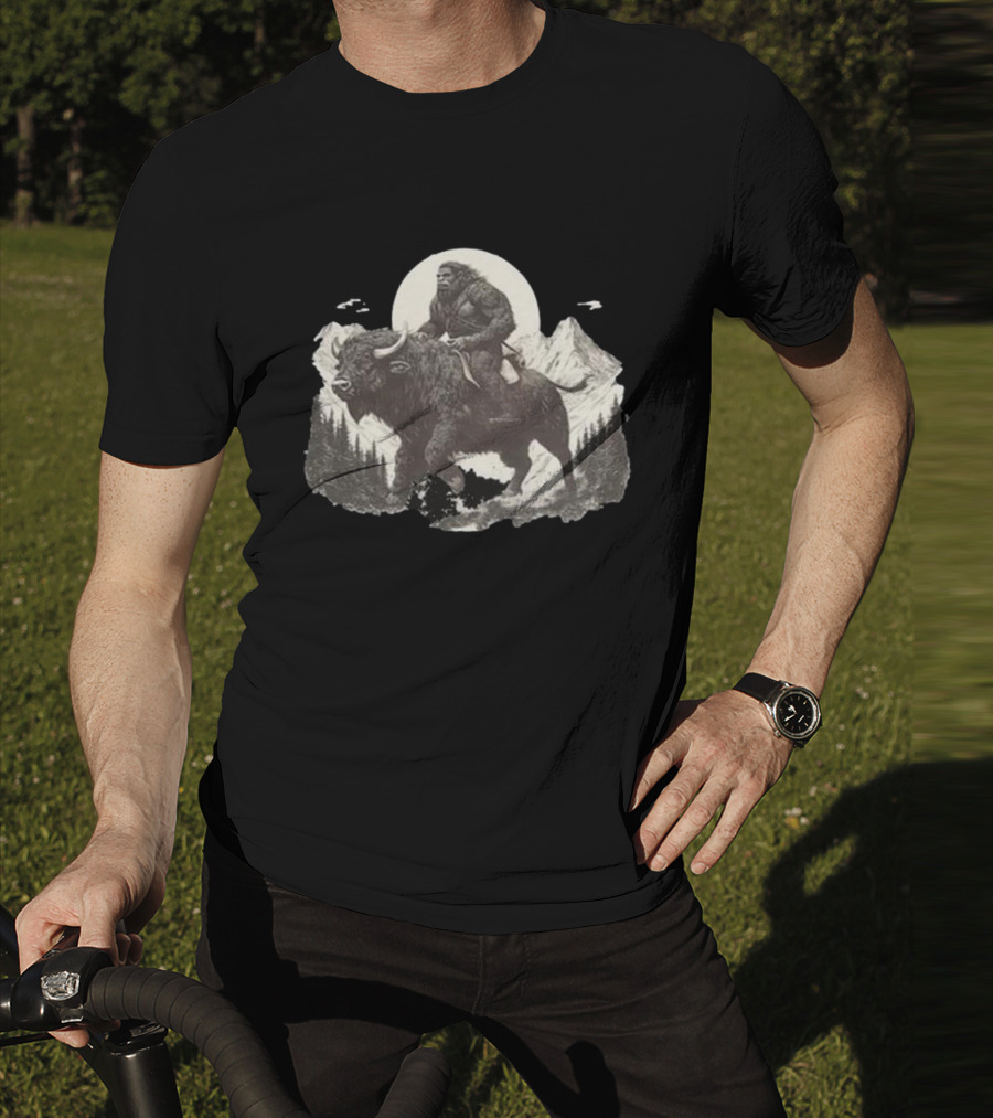 Blurry Creatures Bigfoot Riding Buffalo With Mountains And Moon In Background T-Shirt