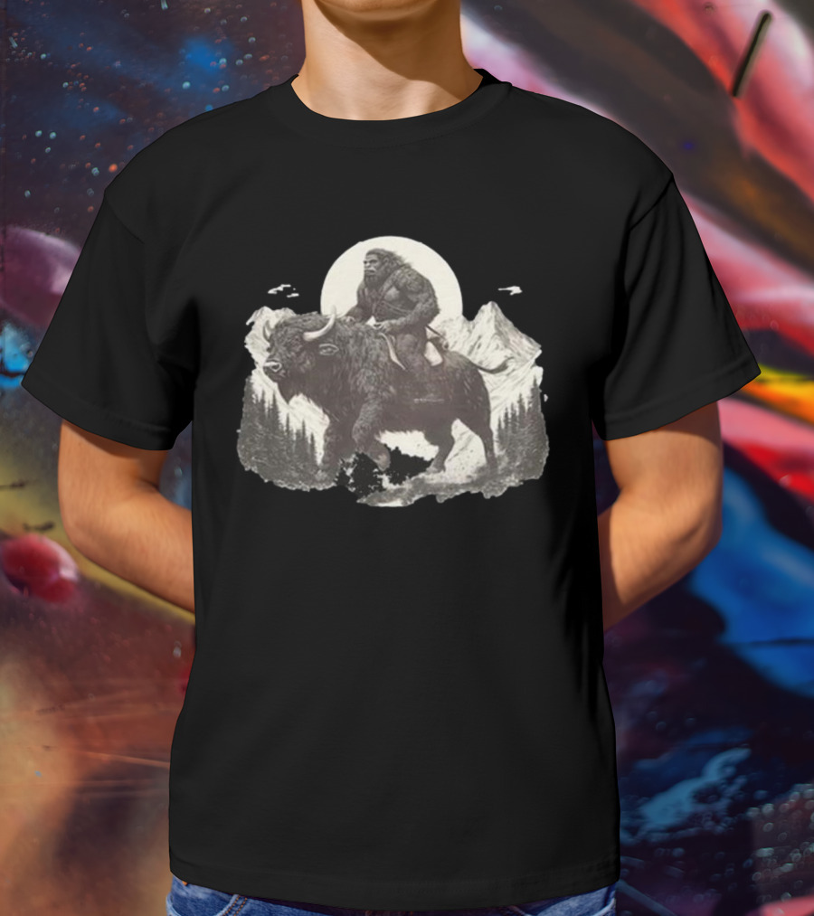Blurry Creatures Bigfoot Riding Buffalo With Mountains And Moon In Background T-Shirt