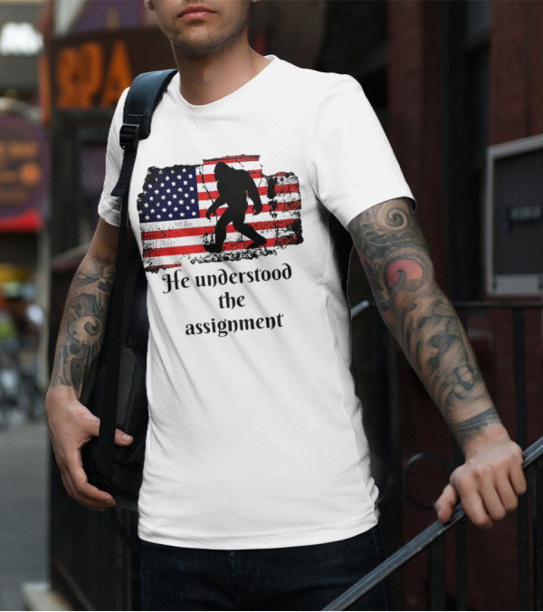 Bigfoot Silhouette With Distressed American Flag He Understood The Assignment T-Shirt