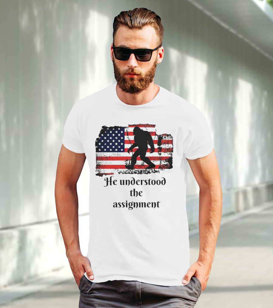 Bigfoot Silhouette With Distressed American Flag He Understood The Assignment T-Shirt
