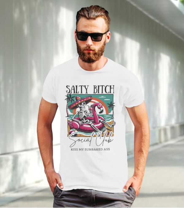 Salty Bitch Skeleton On Flamingo Float In Sunset Beach Scene With Kiss My Sunbaked Ass Text T-Shirt