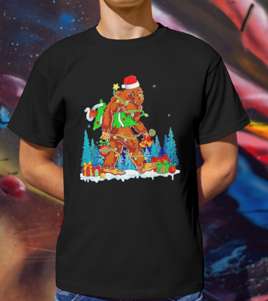 Bigfoot Santa Hugging Christmas Tree With Gifts And Snow Scene T-Shirt