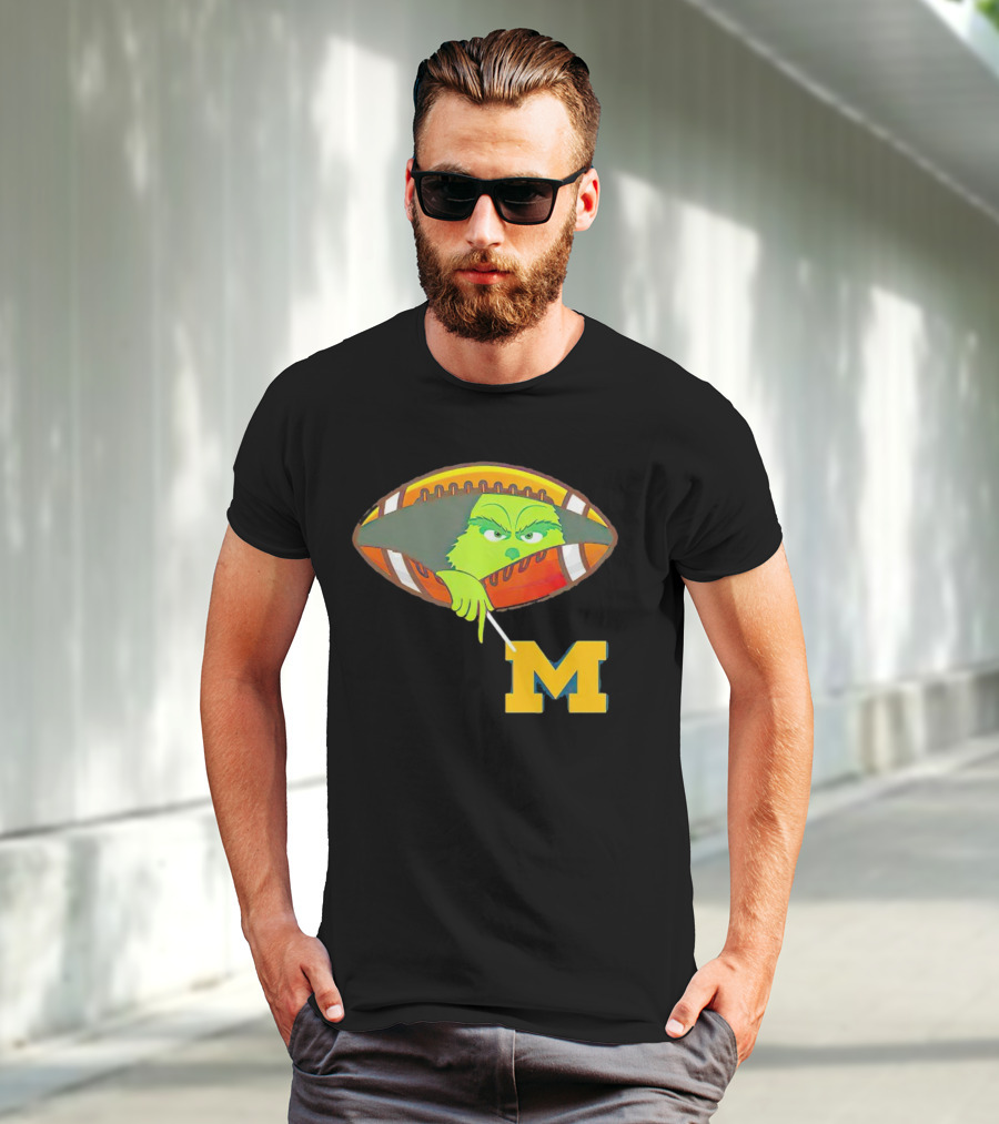 Grinch Peeking From Football Over Michigan Wolverines T-Shirt