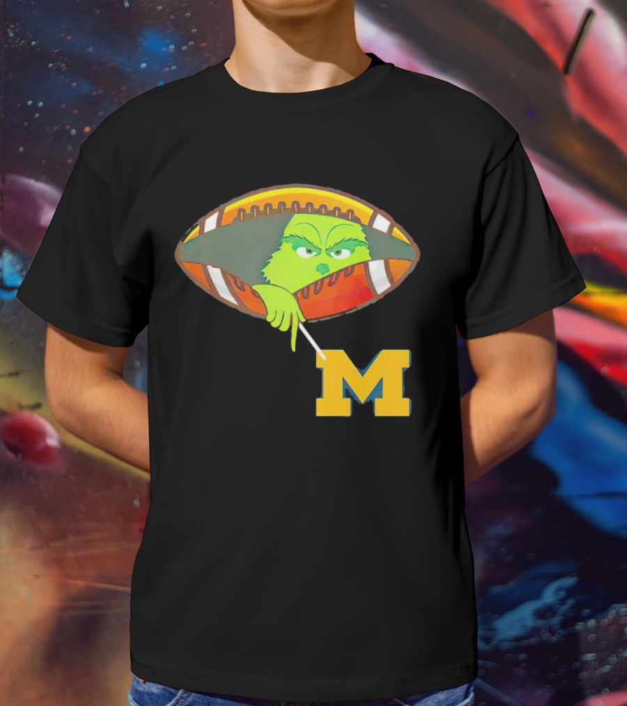 Grinch Peeking From Football Over Michigan Wolverines T-Shirt