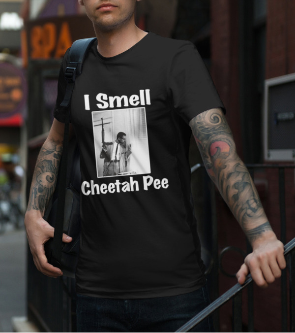 I Smell Cheetah Pee Man Holding Gun By Window T-Shirt