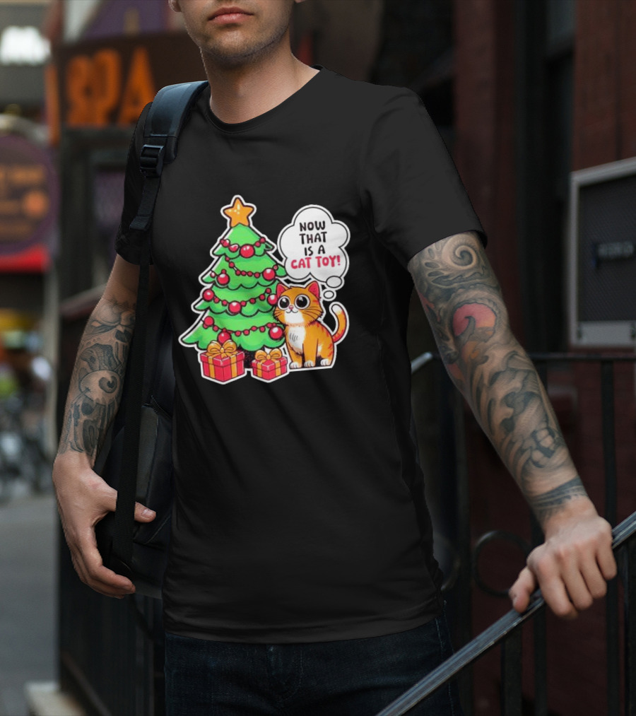 Now That Is A Cat Toy A Cute Orange Cat With Wide Eyes Next To Decorated Christmas Tree T-Shirt