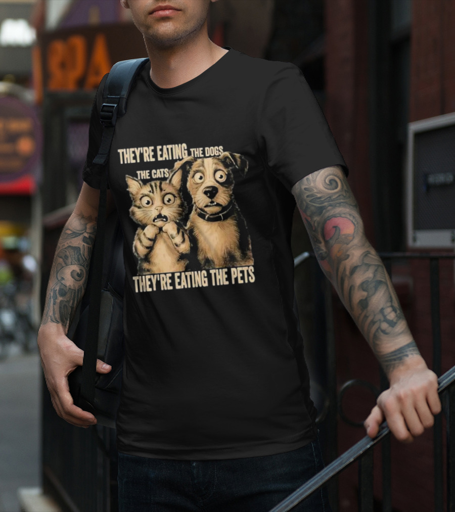 THEY'RE EATING THE DOGS THE CATS THEY'RE EATING THE PETS T-Shirt